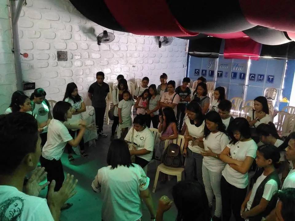 An early prayer circle of young people in the first meeting hall