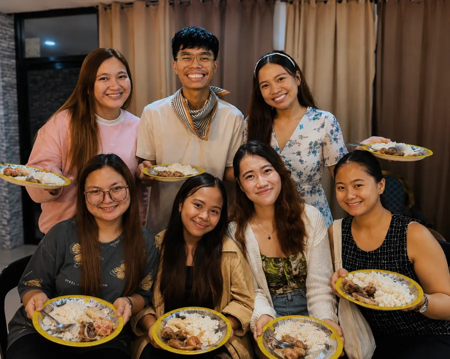 Members sharing a meal together after service
