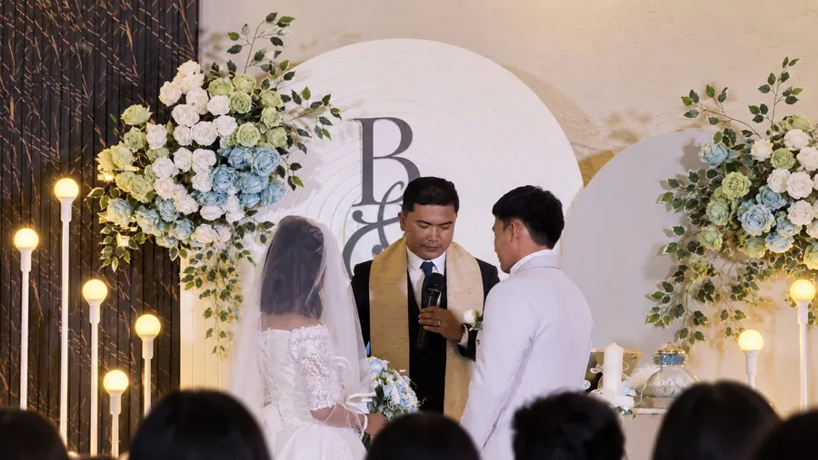 A pastor officiating a wedding ceremony