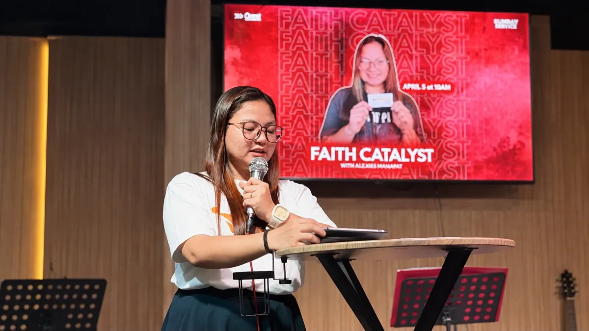 A member sharing her testimony at the lectern during a Sunday service